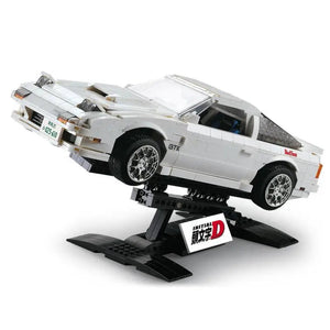 Toy car model on a stand with 'Initial D' branding on a white background