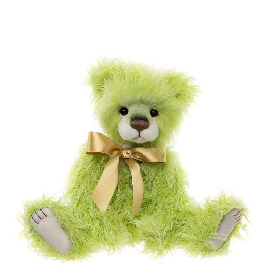 Green teddy bear with a gold bow on a white background