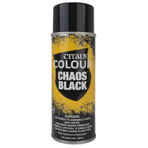 A can of Citadel Colour Chaos Black spray paint, featuring a black cap and a label with a yellow and black chaotic splatter design, set against a plain light gray background.