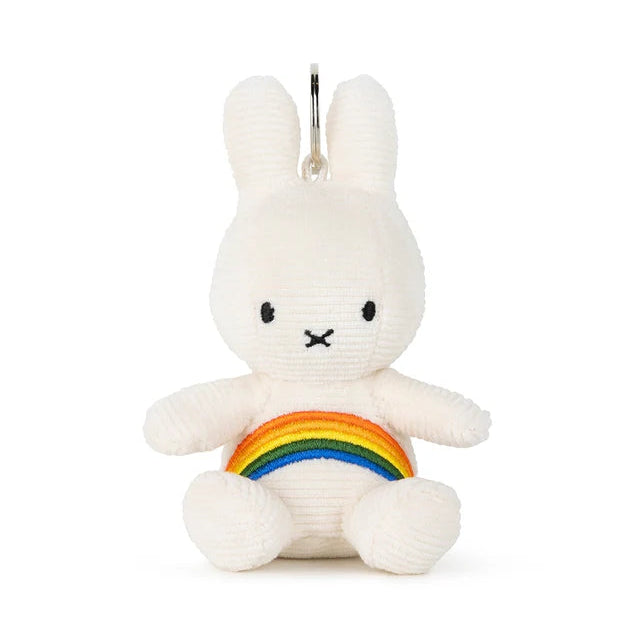 White bunny plush toy with a rainbow on a white background