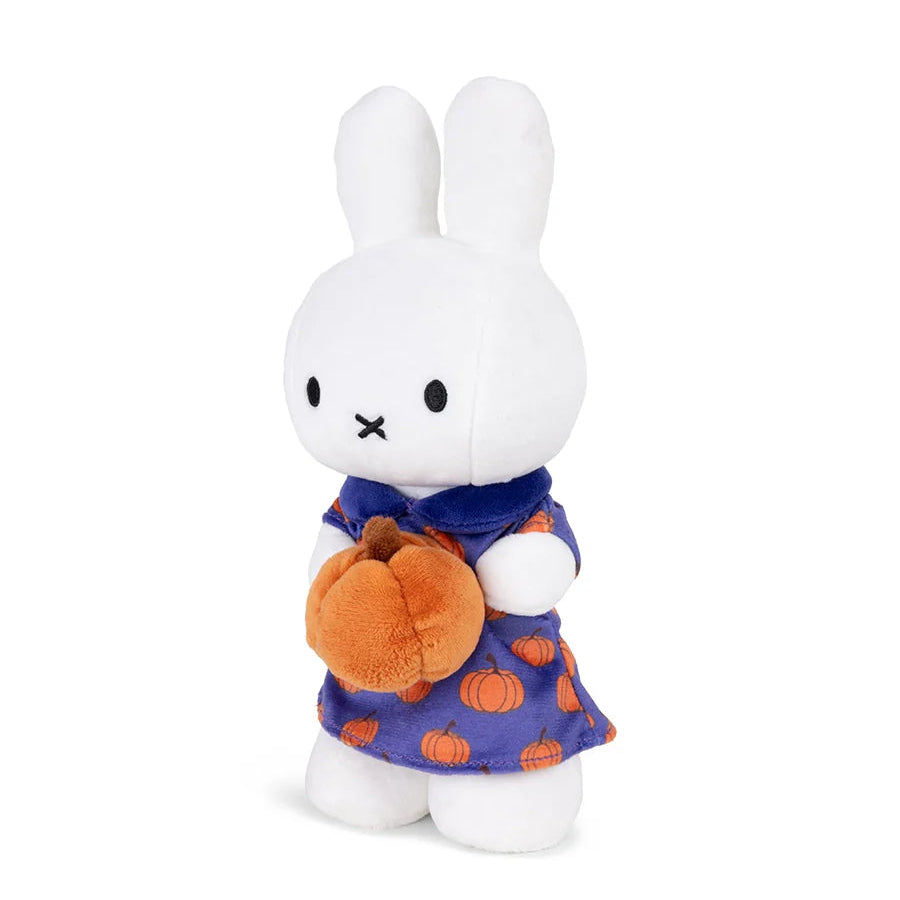 Plush toy rabbit character in a purple outfit with orange pumpkin design on a white background