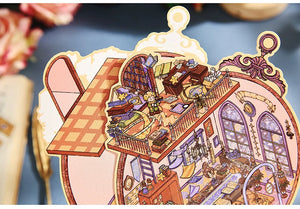 Illustrated scene of a cozy room with bookshelves and furniture on a decorative card.