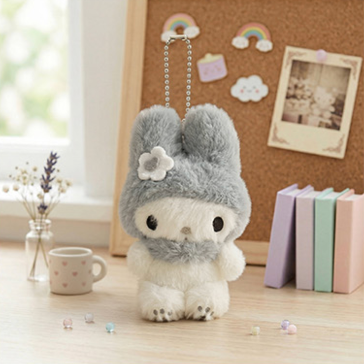 Sanrio My Melody Monochrome Plush Mascot Keychain Charm on a wooden table with a cute background.