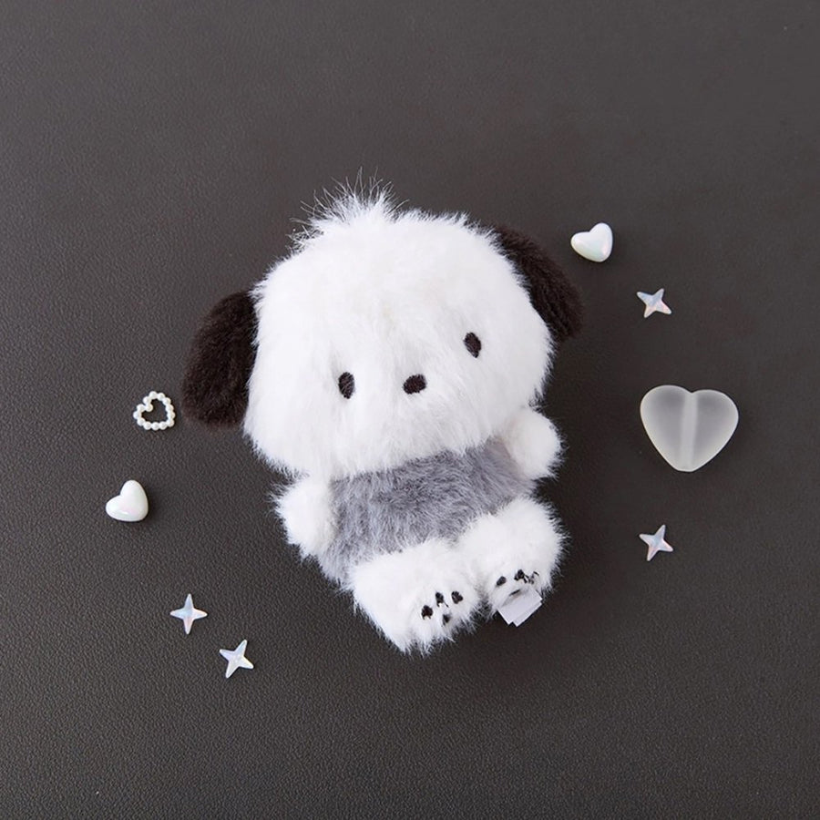 Sanrio Pochacco Monochrome Plush Mascot Keychain Charm surrounded by decorative stars and hearts.