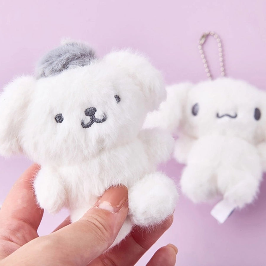 Sanrio Pompompurin Monochrome Plush Mascot Keychain Charm in hand, showcasing fluffy texture and cute design.
