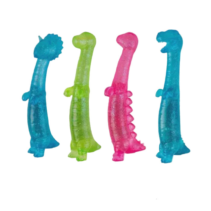 Four translucent dinosaur-shaped novelty items in blue, green, pink, and cyan, shown on a light gray background with a note below stating this is an assortment and one will be selected at random.