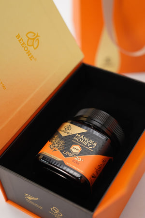 Beezone Manuka Honey jar in an orange box with visible branding.