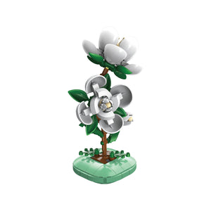 Decorative flower with green leaves and a heart-shaped base on a white background