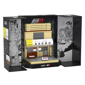 Model of a building with 'Initial D' branding on a black box with illustrations.