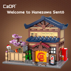 Model of a traditional Japanese building with 'CaDA' branding and 'Welcome to Hanezawa Sentรณ' text.