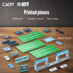 Set of printed pieces for a sports-themed display including a billboard, stadium lawn, team logo, and honor booth on a wooden surface.