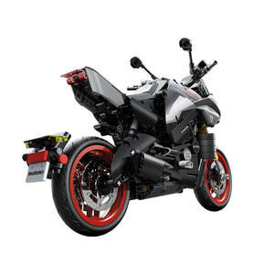 Model motorcycle with red wheels on a white background