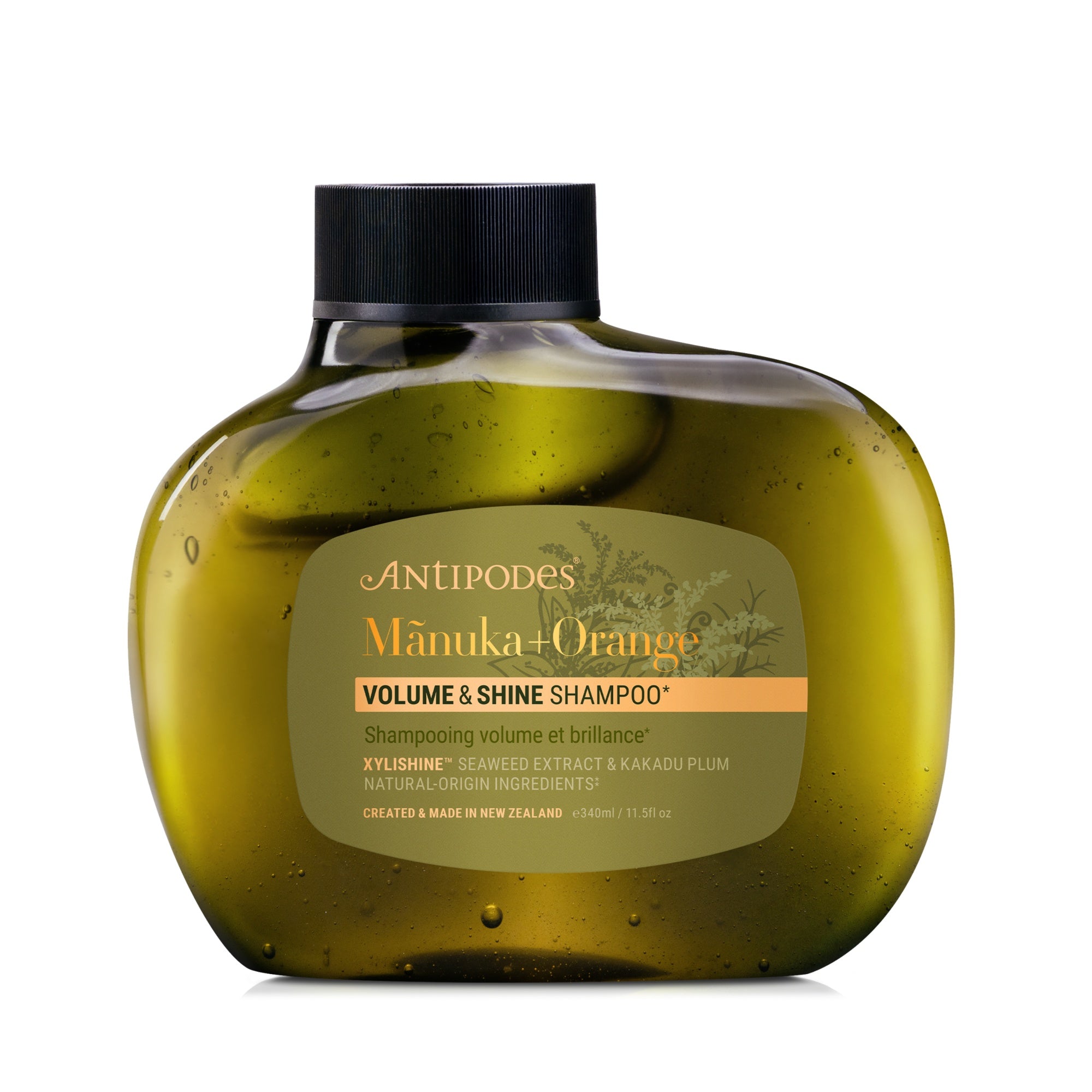 Antipodes Manuka + Orange Volume & Shine Shampoo bottle on a white background