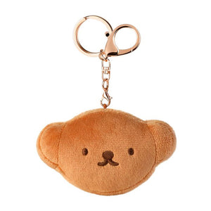 Plush bear keychain with a rose gold clip on a white background