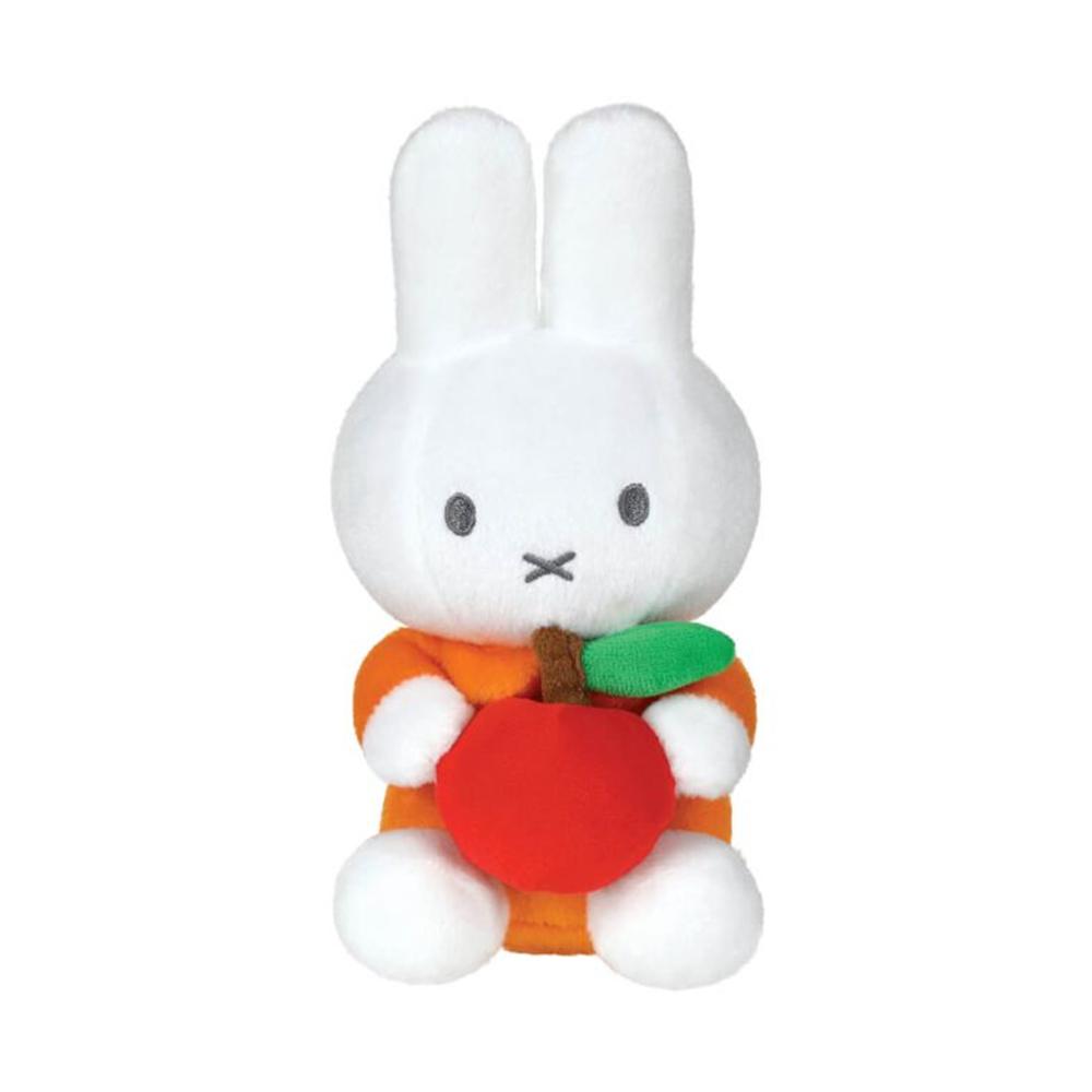 White plush toy with a carrot and green leaf on a white background