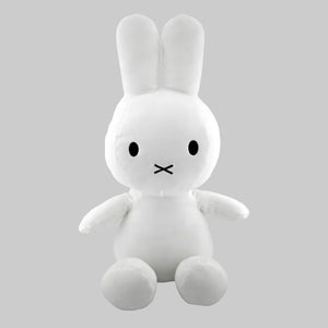 White plush rabbit toy with a simple face on a white background