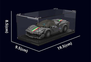 Model car in a clear display case with dimensions indicated on a black background