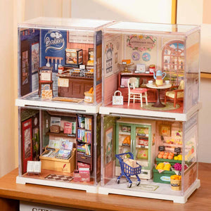 Toy dollhouse with multiple rooms including a kitchen, dining area, and store.