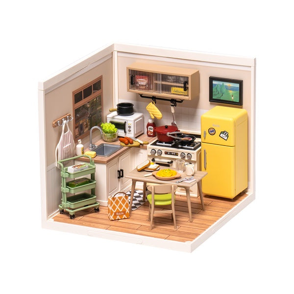 Model kitchen set with various appliances and furniture on a white background