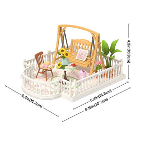 Miniature garden scene with a swing, table, chairs, and plants, including dimensions.