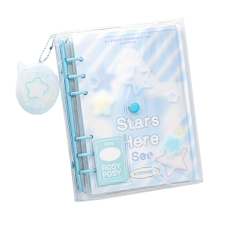 Clear planner with star design and 'Stars Here See' text, featuring a small blue ball and star-shaped object on a white background.