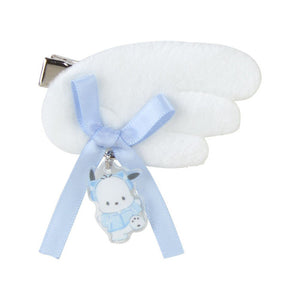 White hair clip with a blue bow and bear charm on a white background