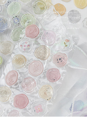 Decorative round seals with floral designs on a white background