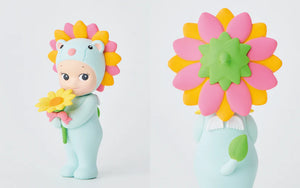 Two colorful figurines with flower designs on a white background