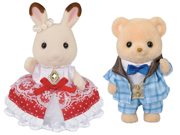 Two plush toys, a rabbit and a bear, dressed in formal attire on a white background.