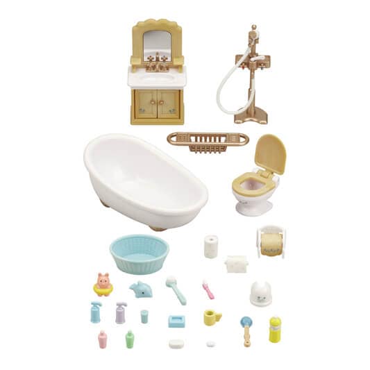 Set of miniature bathroom furniture and accessories on a white background