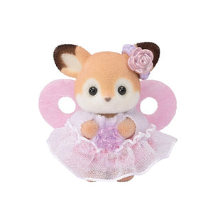 Toy deer in a pink fairy costume with a white background