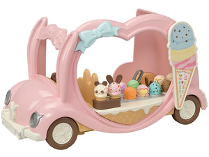Toy ice cream cart with various ice cream cones on a white background