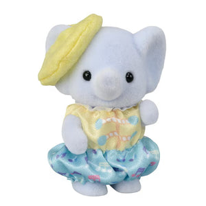 Small plush toy with a yellow hat and dress on a white background
