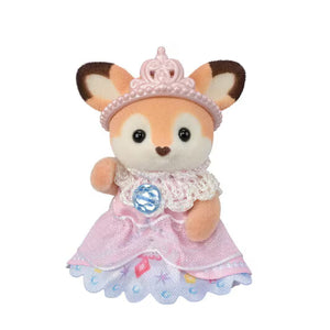 Plush toy fox in a pink dress and tiara on a white background