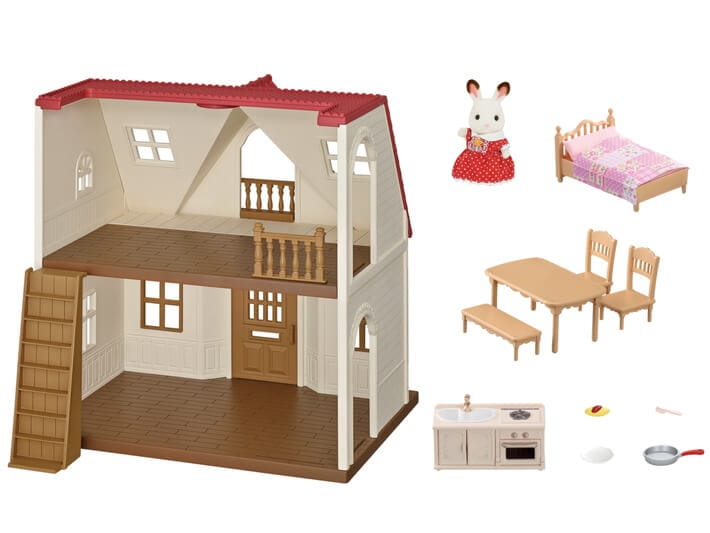 Dollhouse with furniture and accessories on a white background
