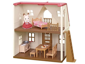 Toy dollhouse with furniture and a mouse figure on a white background