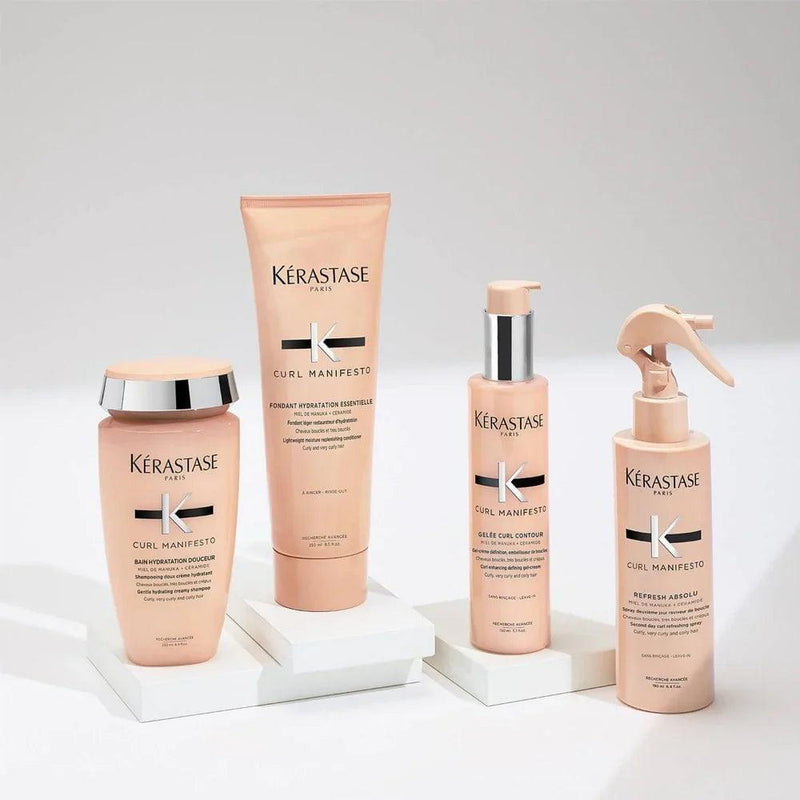 Kérastase Curl Manifesto haircare products for curls, waves, and coils arranged aesthetically on display.