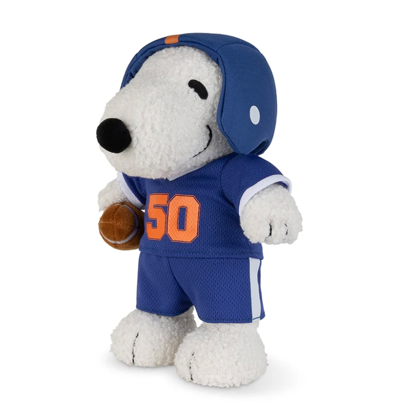 Bon Ton Toys Peanuts American Football Snoopy dressed in a blue football outfit holding a football.