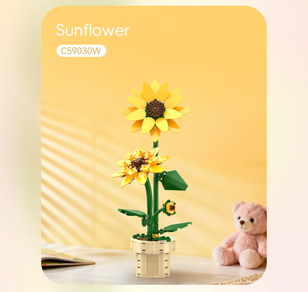CaDA Building Block Flower Bonsai - Sunflower displayed with a cute teddy bear in a bright setting.