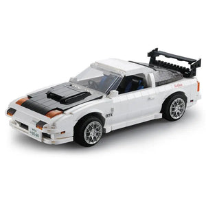 Model car made of building blocks on a white background