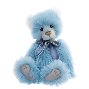 Blue teddy bear with a bow tie on a white background