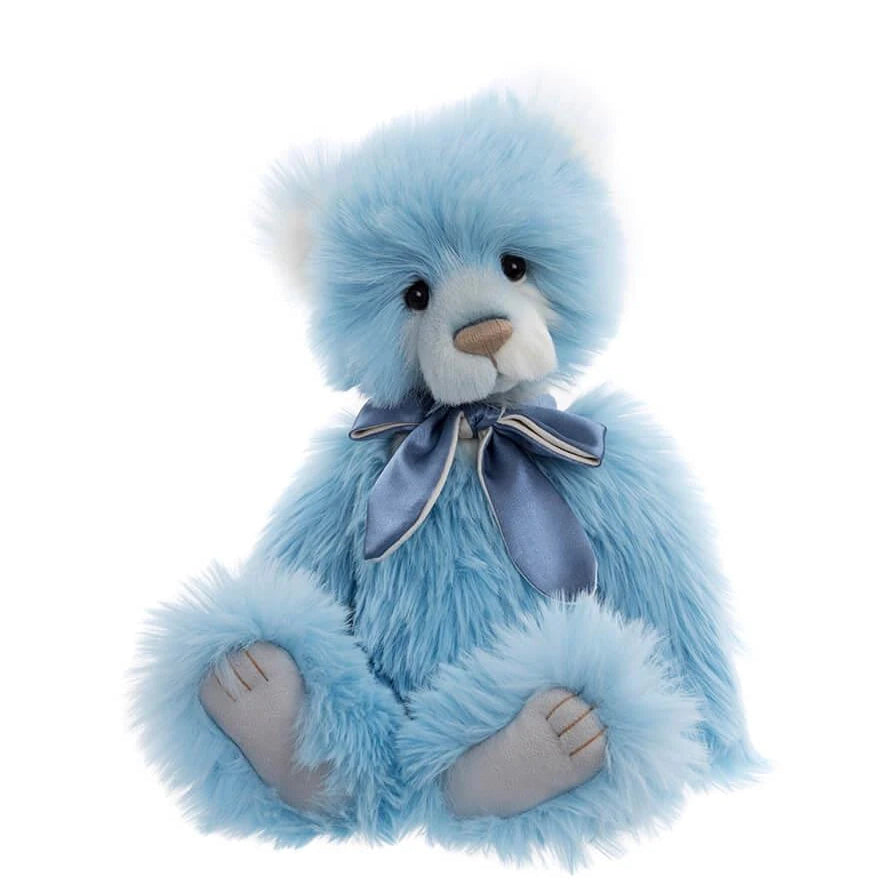 Blue teddy bear with a bow tie on a white background