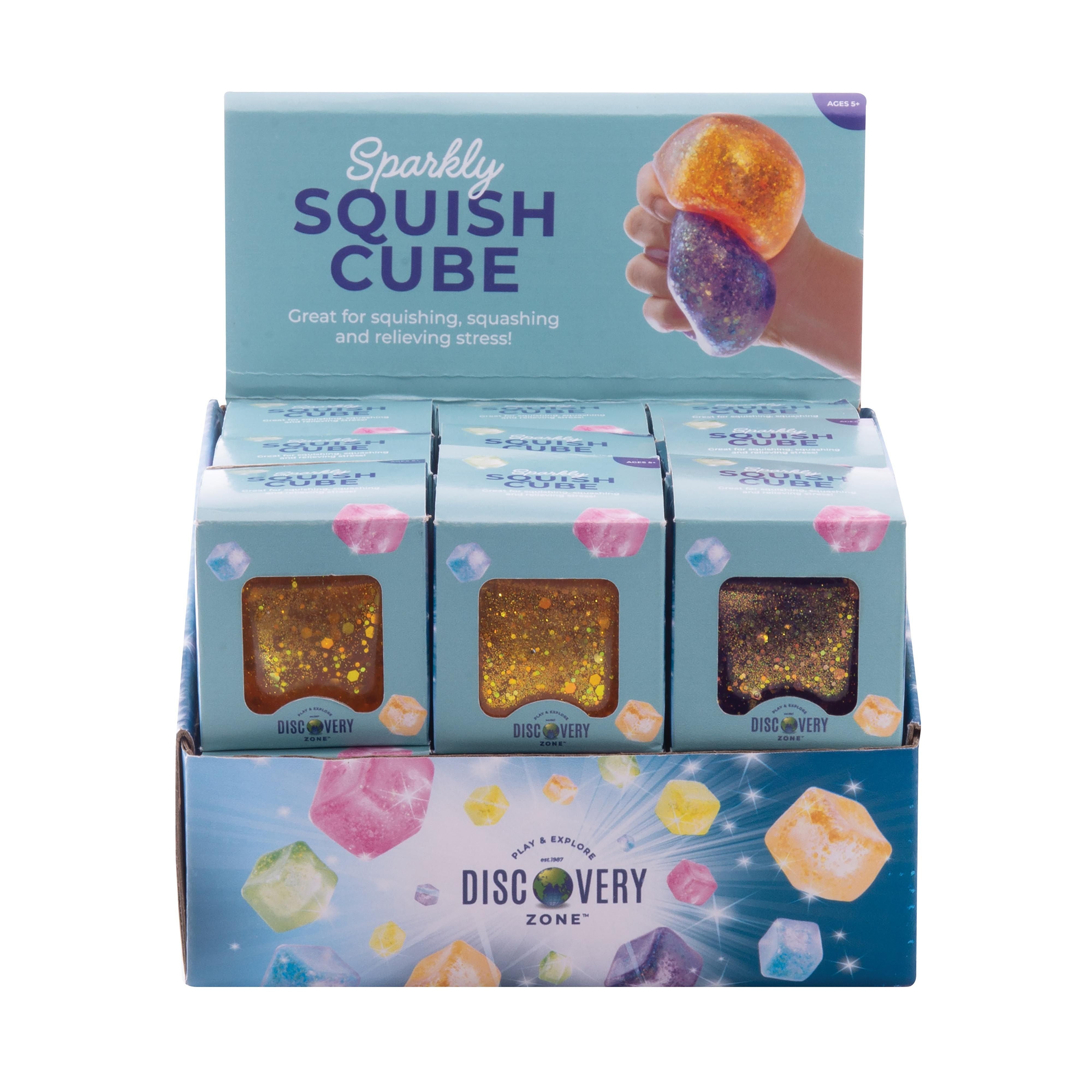 Discovery Zone Sparkly Squish Cube - Assorted display with colorful glittery cubes for stress relief.