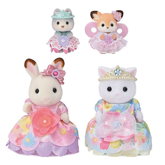 Four small animal figurines in dresses and crowns on a white background