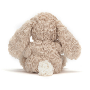 Back view of the Jellycat Yummy Bunny plush toy with floppy ears and a fluffy tail.
