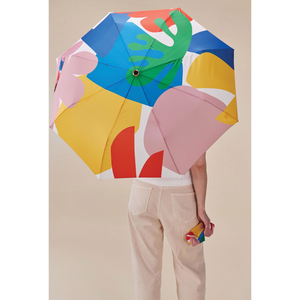 Original DuckHead Duck Umbrella Matisse with colorful print held by a person from behind, ideal for rainy days.