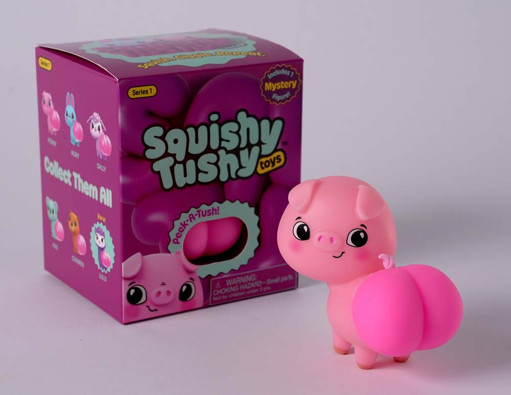 Squishy Tushy Toys Series 1 Blind Box with collectible pig figure and colorful packaging.