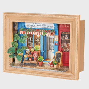 Miniature model of a flower shop with a wooden frame