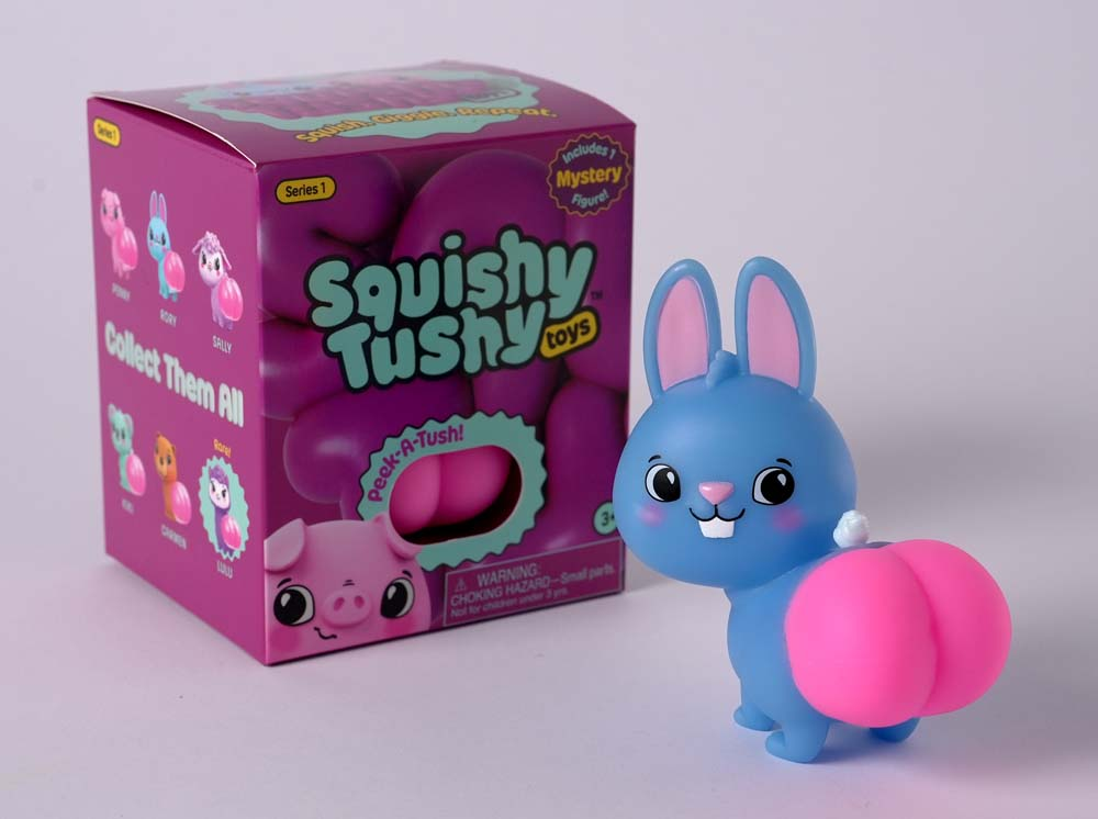 Squishy Tushy Toys Series 1 Blind Box featuring a blue bunny collectible figure with a pink squishy tush.
