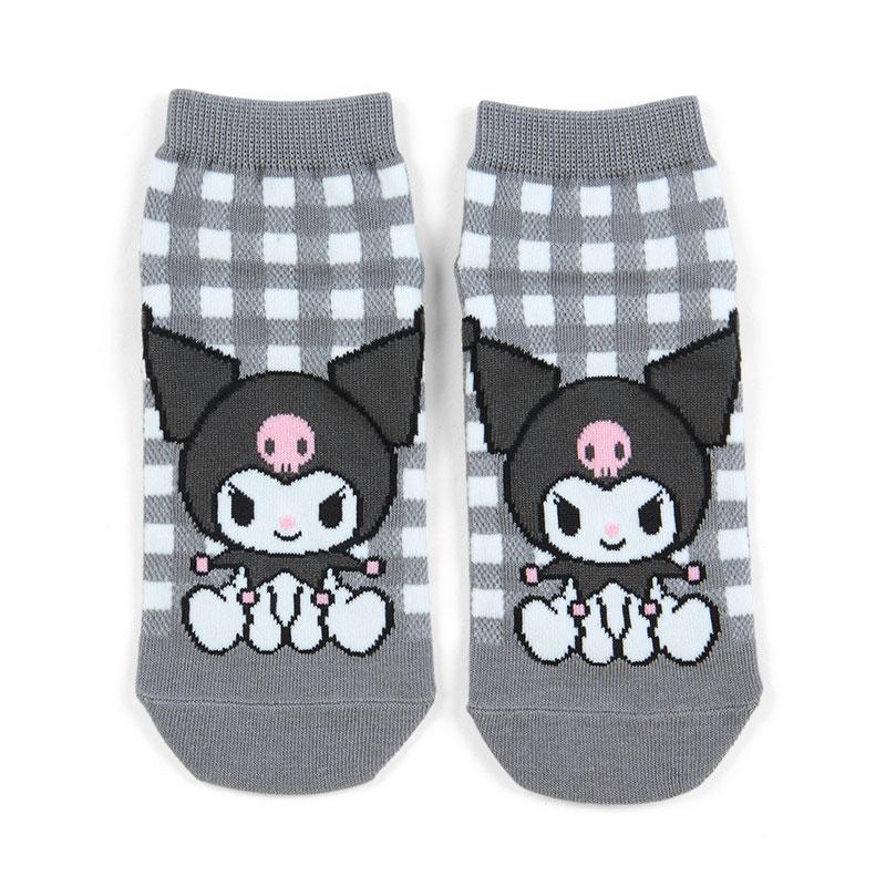 Pair of socks with cartoon character design on a checkered background
